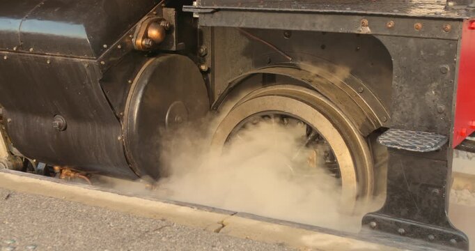 Closeup detail of a vintage steam engine wheel, nostalgic travel experiences in Europe