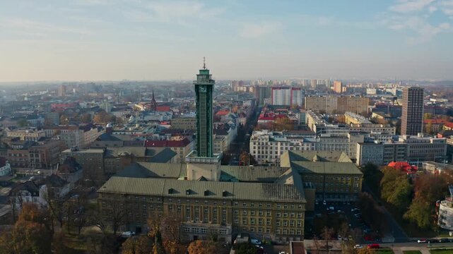 Side drone shot around ostrava city hall tower in summer