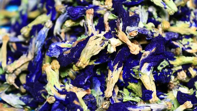 A close-up view of a pile of dried flowers, perfect for use in still life , packaging design, or as a decorative element