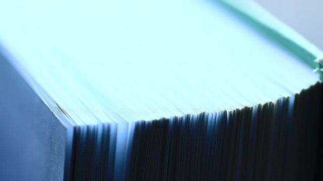 A stack of blue folders sitting on a table, perfect for office or home use