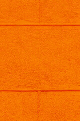 Fototapeta premium Part facade house painted wall brick blocks orange paint exterior architecture home background