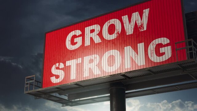 Billboard changing text from Think Big to Act Fast Grow Strong.