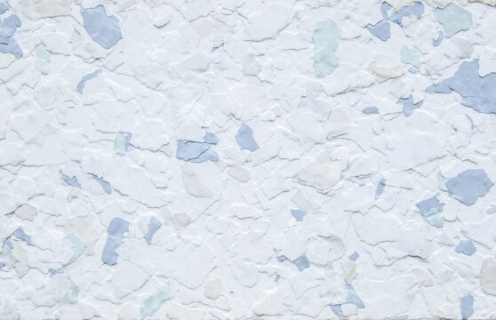 Light blue decorative flakes wall texture or pattern as background