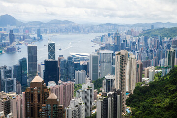 Obraz premium Hong Kong on a cloudy summer day, aerial view taken from Victoria Peak viewpoint