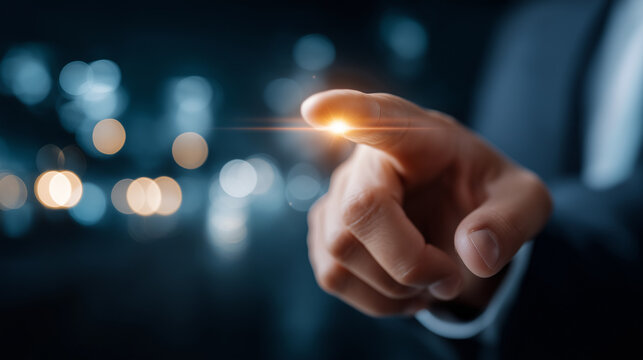 Human Hand Touching Glow: An abstract image of a hand, illuminated by a brilliant glow, poised to interact, suggesting innovation, technology and connection.