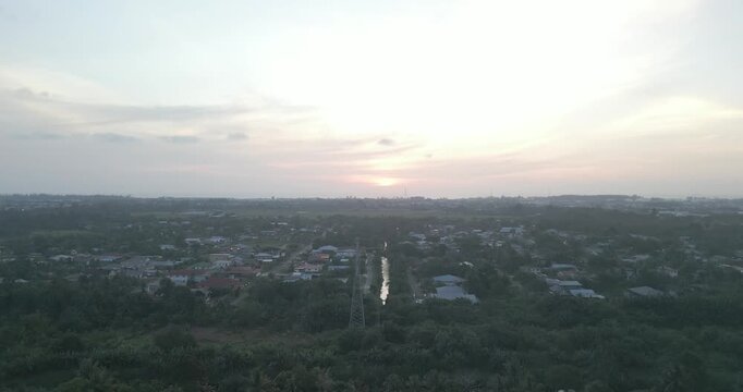Beautiful Sunset Aerial Drone View At Miri Pujut Sarawak,Golden Hours During Evening Summer With View Of River And Green Tress