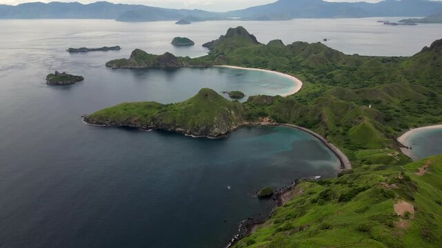 Drone frying over the lush green hills of Padar Island in Komodo Nation Park