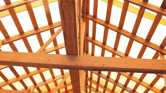 A wooden structure with a skylight above, perfect for outdoor gatherings or events