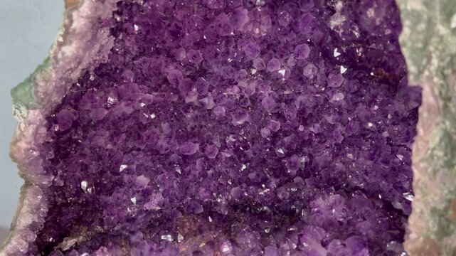Amethyst geode interior rich with purple crystals revealed from the full specimen into sparkling close-up detail