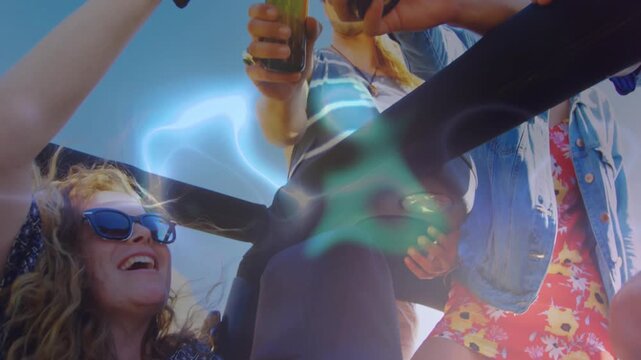 Hand grabbing roll bar initiating friends raising beer bottles, clinking and celebrating day trip