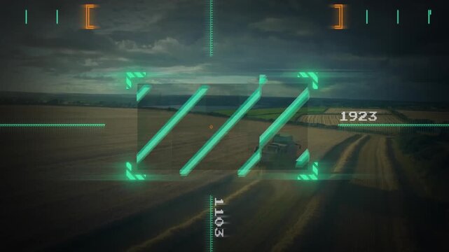 Tracking neon-green target overlay holding center over farmland, tracking harvester on dirt track