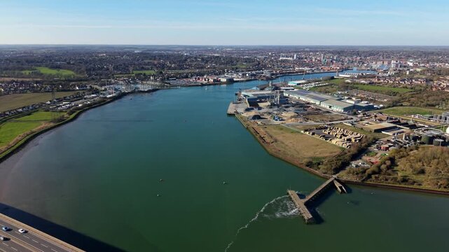 Aerial drone view of the Port of Ipswich and River Orwell industrial sites, showing Cliff Quay and West Bank logistics infrastructure in Suffolk, UK.
