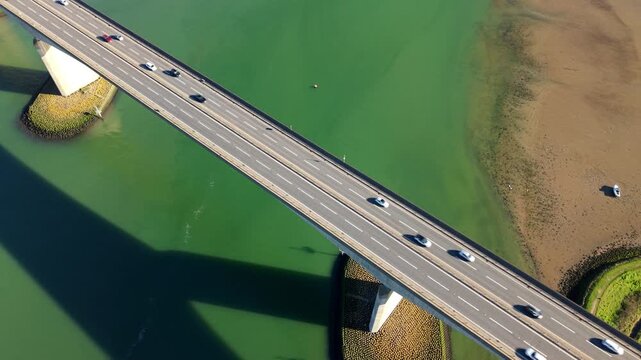 Aerial drone view of Orwell Bridge with traffic crossing over the River Orwell near Ipswich, UK