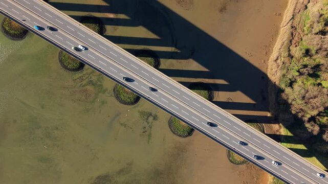 Aerial drone view of Orwell Bridge with traffic crossing over the River Orwell near Ipswich, UK