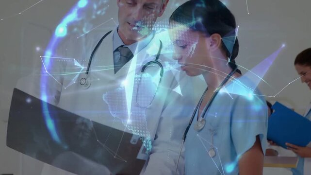 Camera zooming, doctor and nurse in coat and scrubs examining xray at clinic, discussing findings