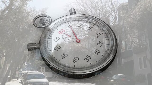 Playback starting, stopwatch overlay with red second hand moving clockwise, tracking street traffic