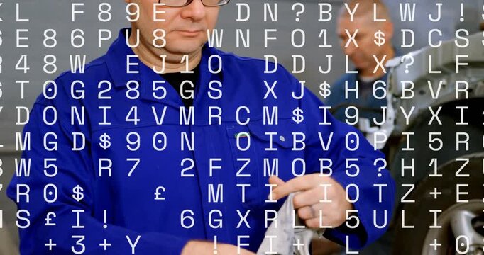 Vertical video: Blue tech cleaning hands with rag after wheel work, white code overlay hiding view