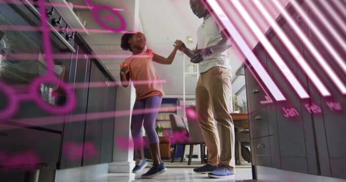 Girl lifting arms starting dance in kitchen dad guiding showing phone, tech overlay hiding or showin
