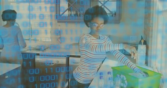 Teenager reaching recycling box, sorting bottles into green bin to recycle, blue binary overlay