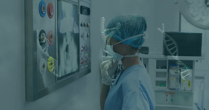 Vertical video: OR nurse using handset and checking knobs and screen preop, DNA helix over scene