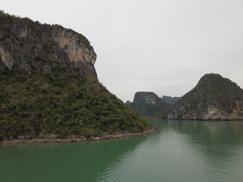 Karst islands and calm water in Ha Long Bay Vietnam