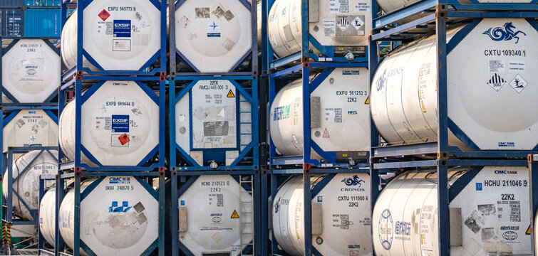 SAMUT PRAKAN, THAILAND-APRIL 16, 2023: Chemical tank container. ISO tank container for chemical delivery. Bulk liquid transport. Chemical company. Container freight area. Global logistics business.