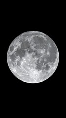 Fototapeta premium Close-up view of the moon against a black background. The lunar surface showcases craters, shadows, and varying gray tones