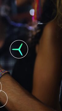 Vertical video: Wrist with band tapping cell in pub showing app icons drifting left friends looking