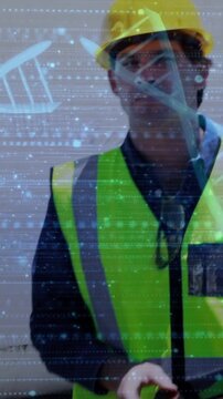 Construction inspector tapping tablet, activating DNA-helix overlay, leaning and surveying site
