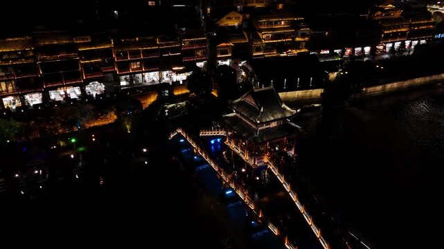Fenghuang, China - 07.11.2025 Aerial flight over Tuojiang River, Fenghuang Ancient Town, China.