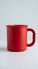 Fototapeta premium Red plastic mug with handle for hot beverages