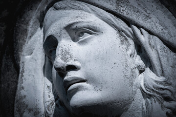 Virgin Mary statue in sorrow, symbol of compassion, grief and spiritual devotion