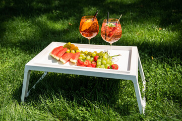 Colorful Summer Drinks with Fresh Fruit Picnic Scene © mprucnal