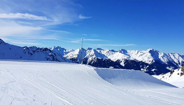 Snowboarding halfpipe background with snowy mountains and blue sky, no people
