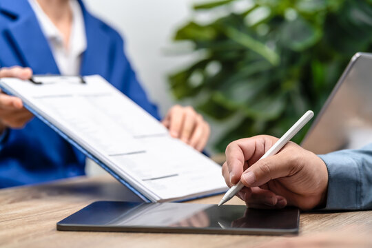 Close Up Man Signing Digital Contract on Tablet, Online Agreement and Insurance Policy Terms Acceptance, Reviewing Conditions and Secure Electronic Signature for Business and Insurance Services