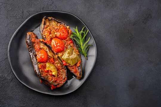 Traditional Turkish Cuisine. Turkish dish eggplant with minced meat Karniyarik or Imam Bayildi	