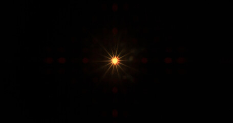 Fototapeta premium Abstract cinematic lens flare with bright light burst and star rays, isolated on black background. Optical light effect ideal for VFX overlays, transitions, titles and dramatic visual accents.