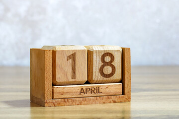 Wooden block calendar displaying April eighteenth date