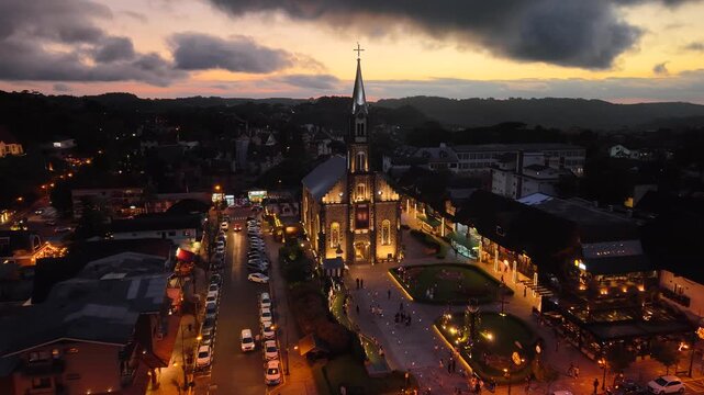 Aerial view of S&atilde;o Pedro Chucrch and houses with European Alpine architecture on Borges de Medeiros Avenue - Gramado, Rio Grande do Sul, Brazil