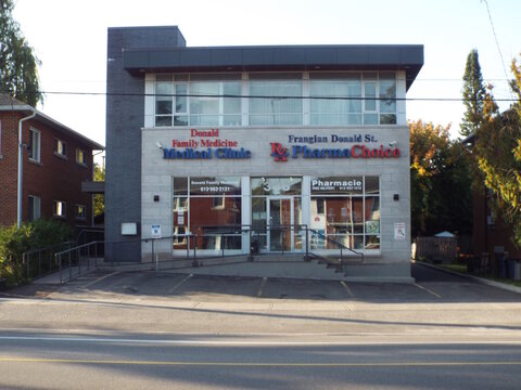 Vanier, Ontario, Canada &ndash; July 25, 2025: A building at 303 Donald Street houses the "Donald Family Medicine Medical Clinic and Frangian Donald St. PharmaChoice pharmacy."
