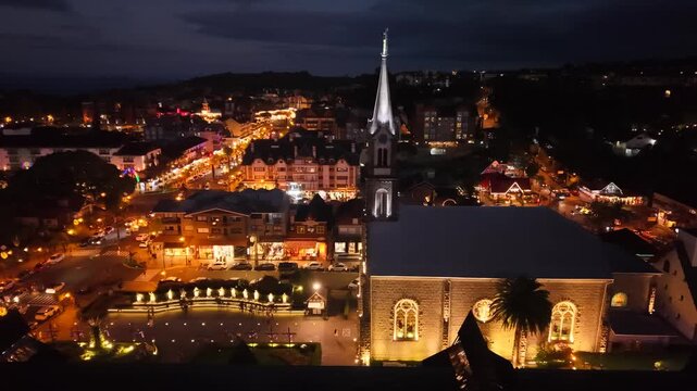 Aerial view of S&atilde;o Pedro Chucrch and houses with European Alpine architecture on Borges de Medeiros Avenue - Gramado, Rio Grande do Sul, Brazil