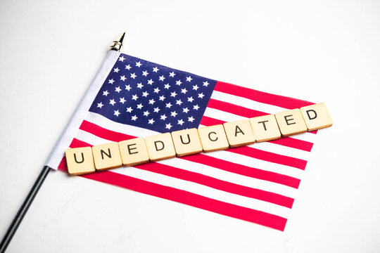The American Flag With An Uneducated Sign Across