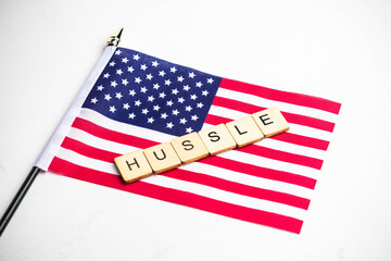 The American Flag With A Hussle Sign Across © Ben Gingell