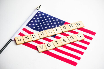 Fototapeta premium The American Flag With An Undecided Voters Sign Across