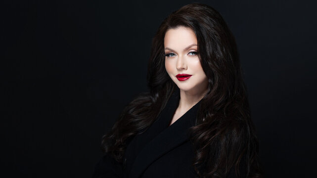 Elegant brunette red lipstick dark studio luxury portrait