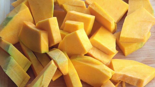 The pumpkin is sliced ​​on a cutting board,Fresh pumpkin 