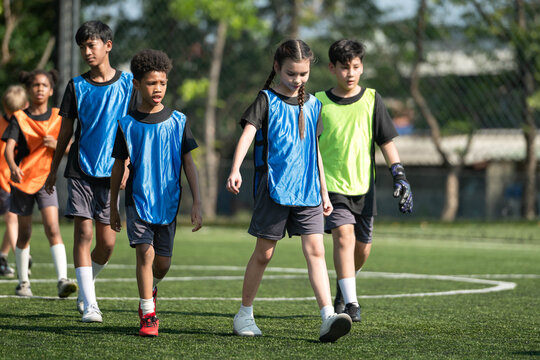 Group of diverse international school children walking together