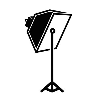 Studio lighting equipment stands upright on a tripod base with a softbox modifier attached.