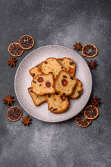 Fototapeta premium Fruit cake, a dessert with cherries, plums, and raisins for a festive Christmas table. Fruit cake