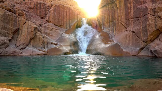 a luxury desert waterfall and infinity pool in Hatta, Dubai. These scenes highlight the  "Liquid Silence" and "Hushpitality" trends, focusing on the intersection of mountain stone and turquoise water